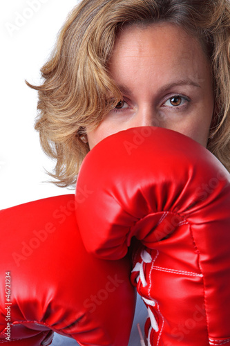 Photo: Woman wearing boxing gloves close up Woman wearing boxing gloves close up