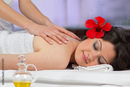 Photo: Woman getting a back massage. Woman getting a back massage.