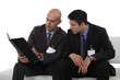 Businessmen Reading A Report