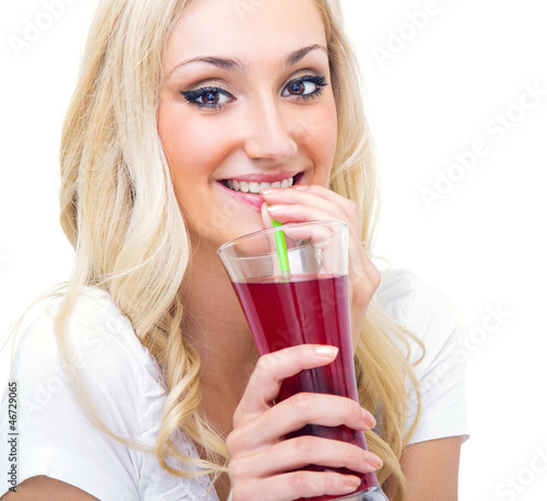 Photo: Young woman drinking lemonade, studio-shot Young woman drinking lemonade, studio-shot