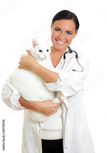 Photo: Veterinarian with a cat in her arms. Isolated on white. Veterinarian with a cat in her arms. Isolated on white.