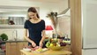 Happy couple in kitchen preparing meal