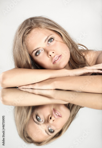 Photo: Beautiful girl with a mirror Beautiful girl with a mirror