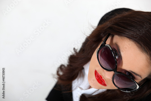 Photo: Businesswoman wearing sunglasses Businesswoman wearing sunglasses