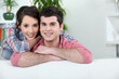 Young couple relaxing on sofa