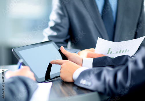 Photo: Businessman holding digital tablet Businessman holding digital tablet