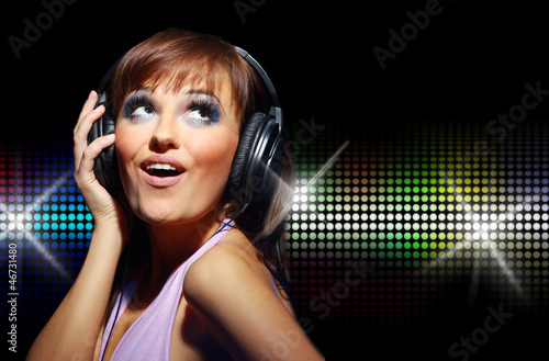 Photo: Portrait of happy girl listening a music in headphone Portrait of happy girl listening a music in headphone