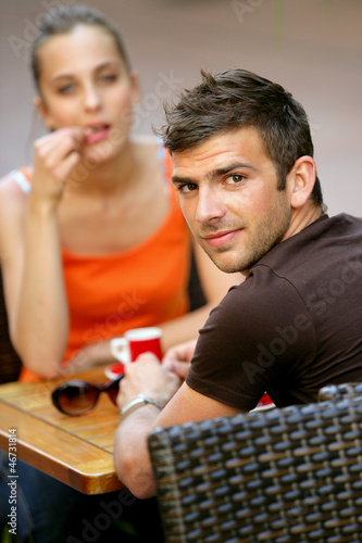 Photo: Couple having a coffee on terrace Couple having a coffee on terrace
