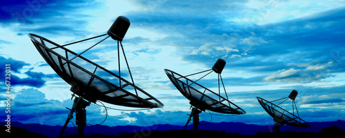 Photo: satellite dish antennas under blue sky satellite dish antennas under blue sky