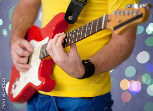 Photo: Hands playing on guitar Hands playing on guitar
