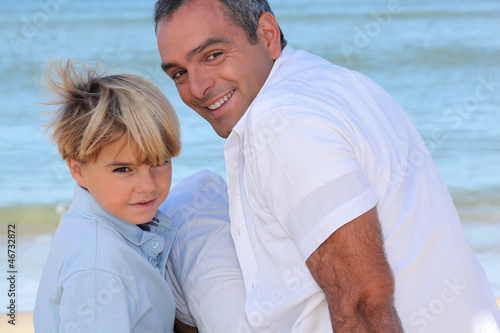 Photo: Father and son on the beach Father and son on the beach