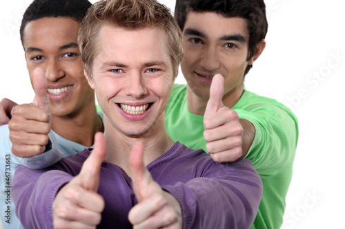 Photo: Three teenagers giving the thumbs-up Three teenagers giving the thumbs-up