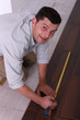 Man using a measuring tape