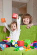 Happy mother plays with child