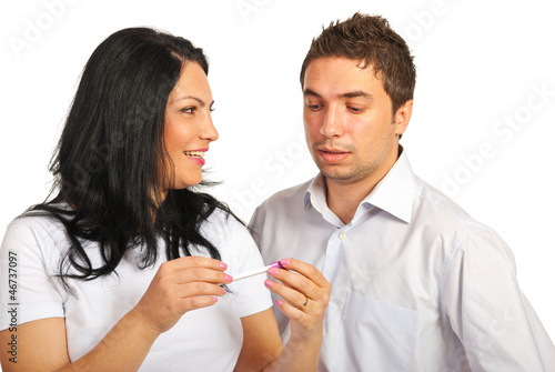 Photo: Couple holding pregnancy test Couple holding pregnancy test