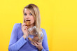 Woman eating biscuit from jar
