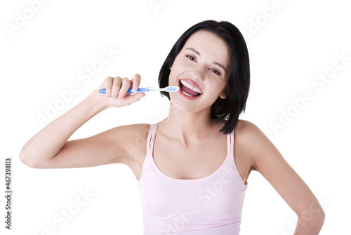 Photo: Woman with great teeth holding tooth brush Woman with great teeth holding tooth brush