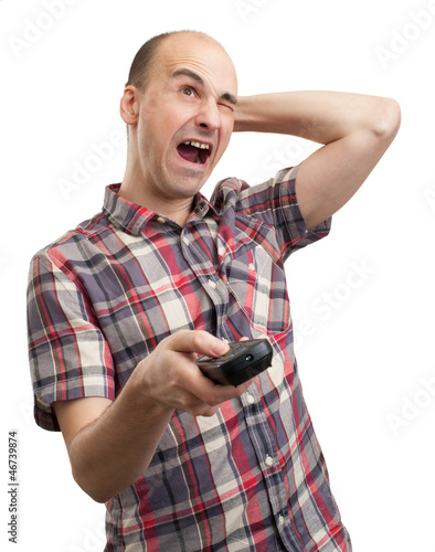 Photo: funny man with tv remote control funny man with tv remote control