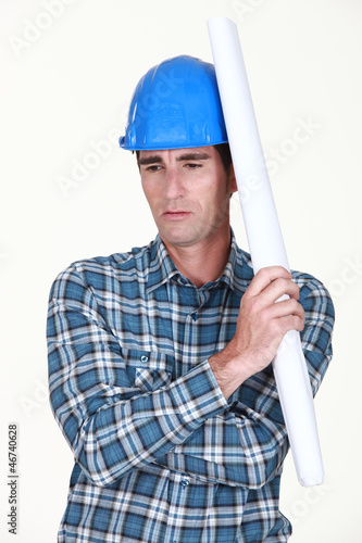 Photo: A construction worker deep in his thoughts A construction worker deep in his thoughts