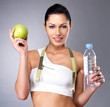 Foto: Healthy woman with apple and bottle of water Healthy woman with apple and bottle of water