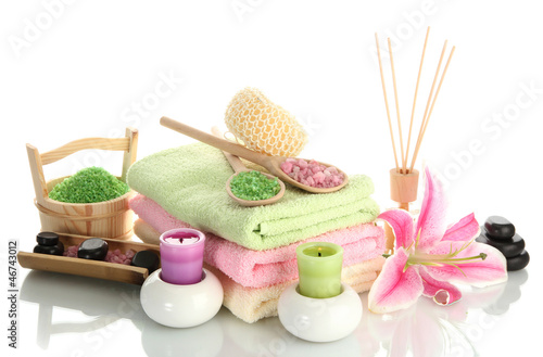 Photo: beautiful spa setting with lily isolated on white beautiful spa setting with lily isolated on white
