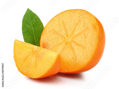 Photo: Slice and Half Persimmon with green leaves Slice and Half Persimmon with green leaves