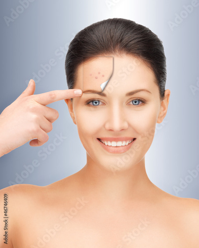 Photo: beautiful woman pointing to forehead beautiful woman pointing to forehead