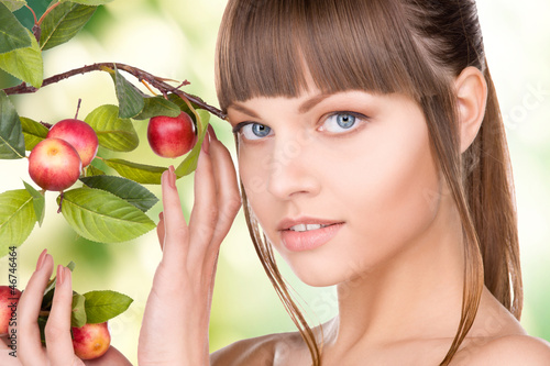 Photo: lovely woman with apple twig lovely woman with apple twig