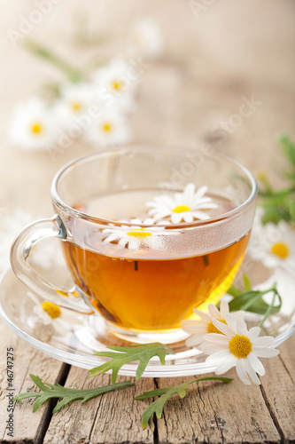 Photo: cup of herbal tea with chamomile flowers cup of herbal tea with chamomile flowers