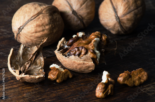 Photo: Walnuts on wooden table close up Walnuts on wooden table close up