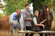Foto: A couple on a horse ride. A couple on a horse ride.