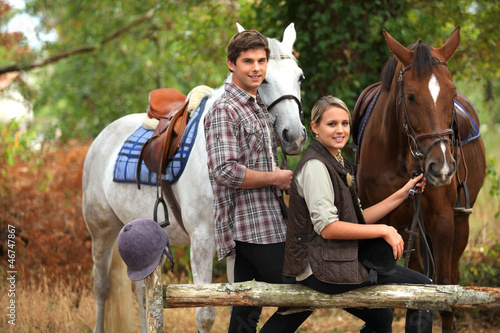 Photo: A couple on a horse ride. A couple on a horse ride.