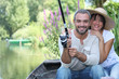 Romantic couple fishing on the river