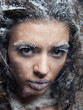 Portrait of young woman with snow make-up. Christmas snow queen