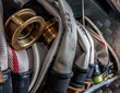 Old fire hoses placed in a compartment of the fire truck