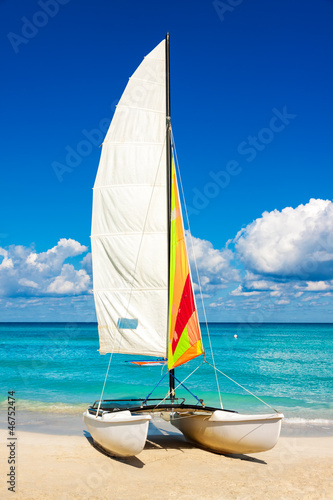 Photo: Sailing boat at a tropical beach in Cuba Sailing boat at a tropical beach in Cuba