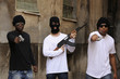Gang members with guns and rifle on the street