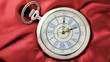 Clock ticks off seconds marked by ornate hands roman numerals.
