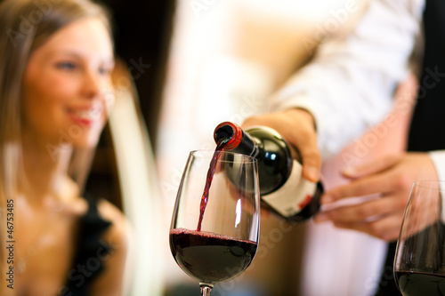 Photo: Waiter serving red wine Waiter serving red wine