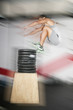 Athletic man jumping over a lot of weights