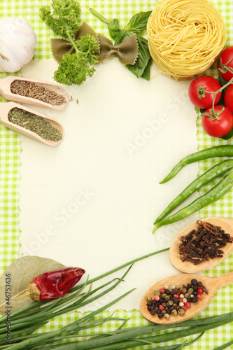 Photo: paper for recipes,vegetables and spices on green background paper for recipes,vegetables and spices on green background
