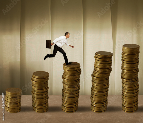 Photo: Jumping businessman on money Jumping businessman on money