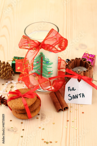 Photo: Cookies for Santa: Conceptual image of ginger cookies, milk and Cookies for Santa: Conceptual image of ginger cookies, milk and