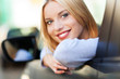 Young woman sitting in car