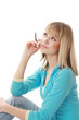 Photo: Thoughtful young college girl with pen Thoughtful young college girl with pen
