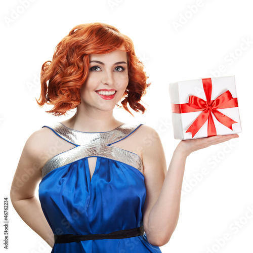 Photo: Young happy woman with a gift. Isolated over white Young happy woman with a gift. Isolated over white