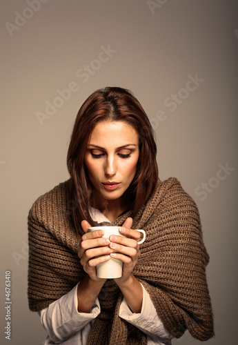 Photo: Attractive Woman Drinking a Hot Coffee Attractive Woman Drinking a Hot Coffee