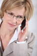 Businesswoman making call