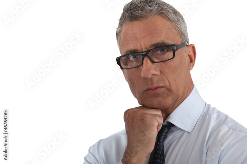 Photo: Portrait of a man wearing thick-rimmed glasses Portrait of a man wearing thick-rimmed glasses