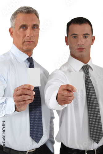 Photo: Businessmen showing blank business cards Businessmen showing blank business cards